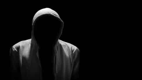 Portrait of Invisible man in the hood isolated on black أضواء كاشفة على التطرف