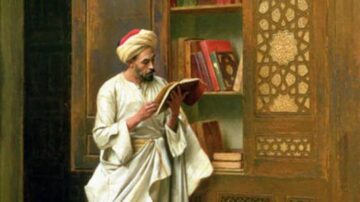 رجل يرتدي ملابس تقليدية عربية يقف في مكتبة تاريخية، يقرأ كتابًا. الكتب موضوعة في رفوف خشبية مزخرفة. تعكس الإضاءة الدافئة الجو الثقافي والمعرفي للمكان.