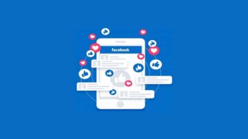 صورة توضح تفاعل المستخدمين على فيسبوك من خلال هاتف ذكي، مع ظهور أيقونات الإعجاب والقلوب والرسائل، مما يعكس النشاط الاجتماعي على المنصة.