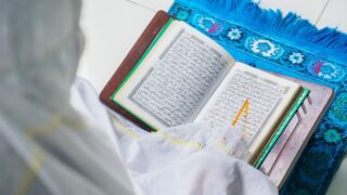 A Muslim woman reading Quran