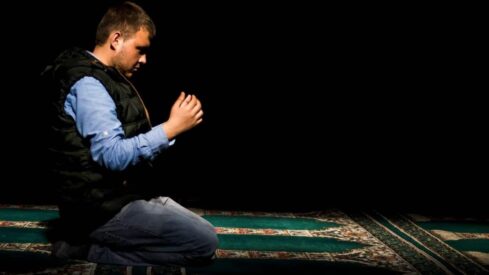 A man praying after Salah