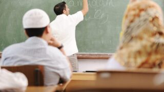 Muslim teacher inside the class