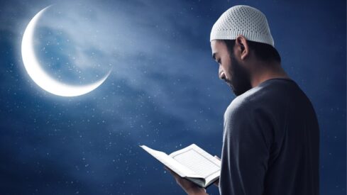 Muslim man reading holy quran
