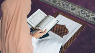 A Muslim woman reading the Quran