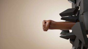 يد قوية بلون بني تخرج من جدار مكسور، تعبر عن القوة والعزيمة.