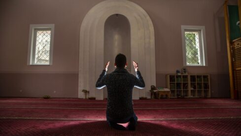 young Muslim praying
