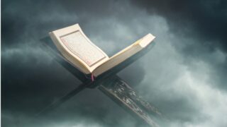 Open book resting on a stand, surrounded by soft, swirling clouds. The pages display intricate text, suggesting a focus on literature or spirituality. The ethereal background enhances the book's significance, evoking a sense of contemplation and reverence.