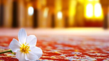 White flower with yellow center resting on a vibrant red carpet, softly blurred background with warm, glowing light. Ideal for nature and interior decor themes.