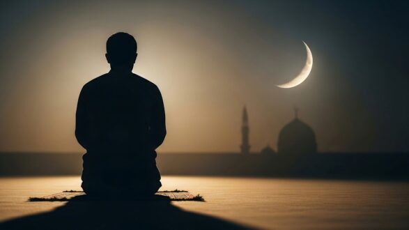 Silhouette of a person in a meditative pose on a prayer mat, with a crescent moon and mosque silhouette in the background during twilight.