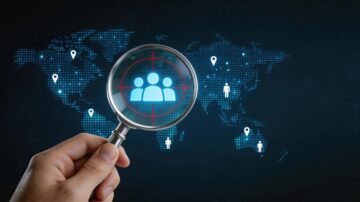 Hand holding magnifying glass over digital world map representing the Quranic methodology in combating rumors and global psychological warfare