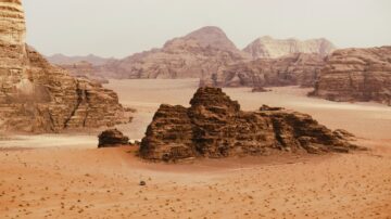 The orange sands of Wadi Rum desert under hazy clouds, symbolizing the solitude and strength found when even Prophets felt distress and turned to God.