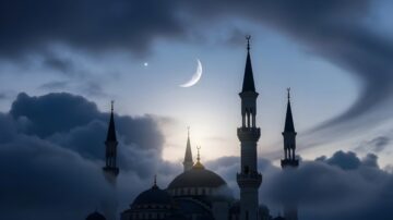 A silhouetted mosque with multiple minarets against a twilight sky with a crescent moon, capturing the sacred atmosphere of the best days to apply practical tips for Dhul-Hijjah