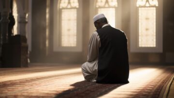 Muslim man in traditional attire praying in a serene mosque interior, illuminated by soft sunlight filtering through stained glass windows, creating a peaceful and reflective atmosphere to overcome depression in Islam.