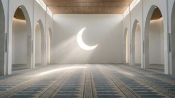 Interior of a spacious, modern mosque featuring tall, arched white walls and a large crescent moon window reflecting the peaceful spirit of charity in Islam.