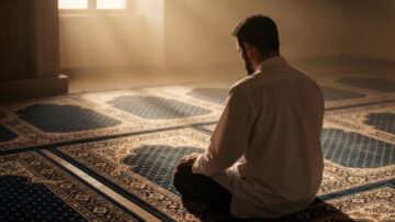 A Muslim man sitting in quiet reflection, representing Muraqabah and emotional intelligence in Islam.