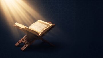 Innovation in religion: Open Quran on a wooden stand illuminated by soft light against a dark background, highlighting its intricate text and design.